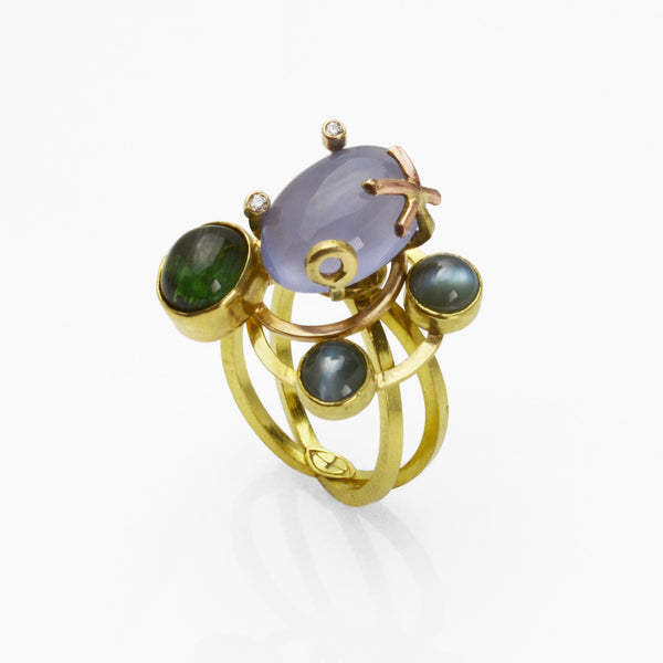 Lysithea Orbit Ring in 18k gold with rare gems in vivid ocean hues