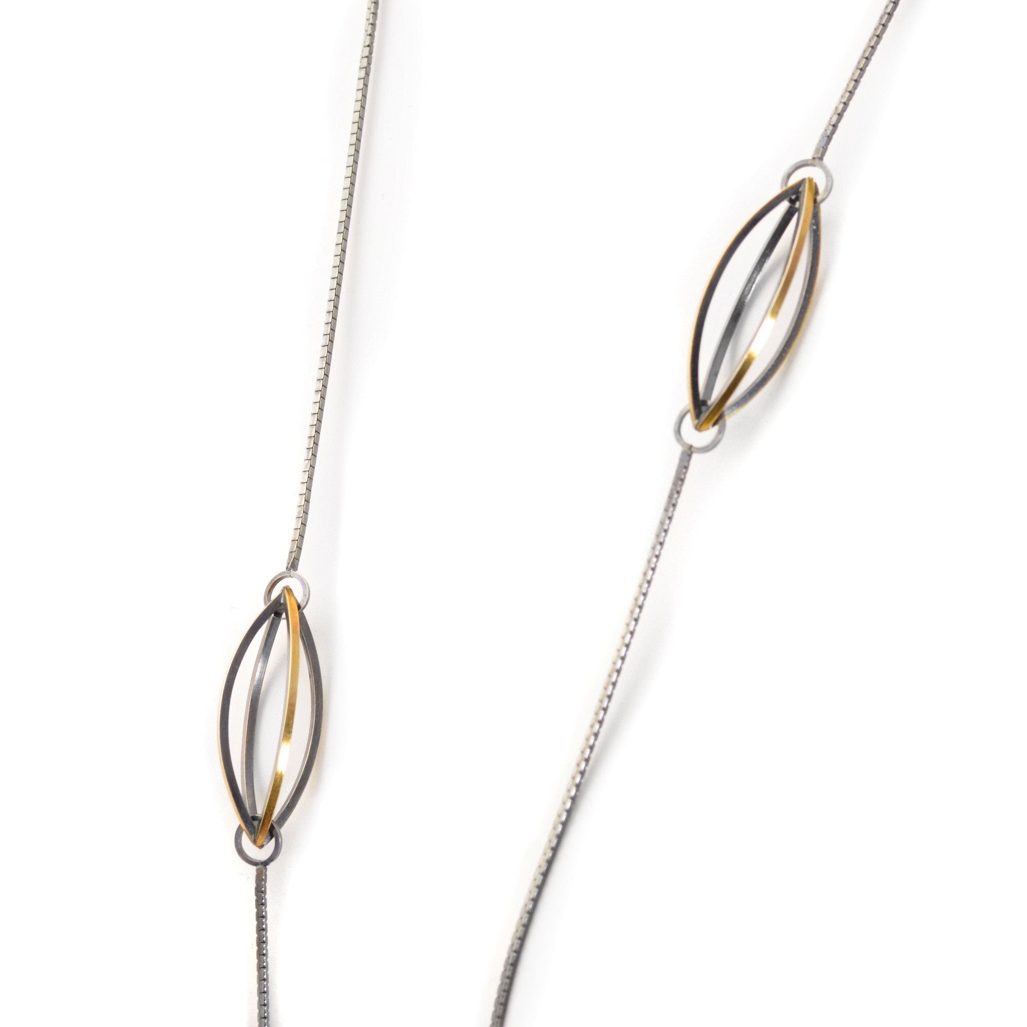 Lattis Long Necklace with Three Streamline Shapes in Sterling Silver, 22k gold and Blackened Patina