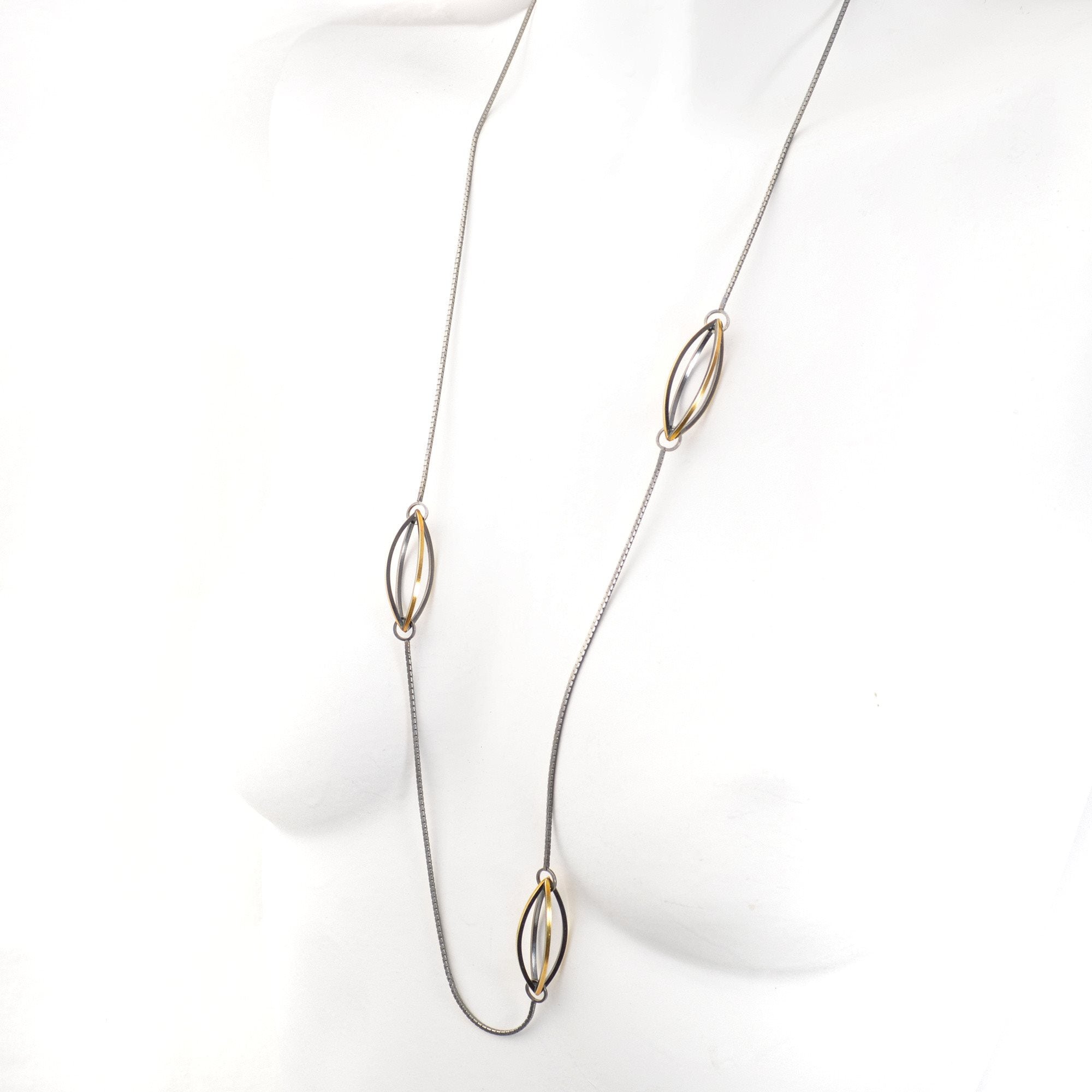 Lattis Long Necklace with Three Streamline Shapes in Sterling Silver, 22k gold and Blackened Patina