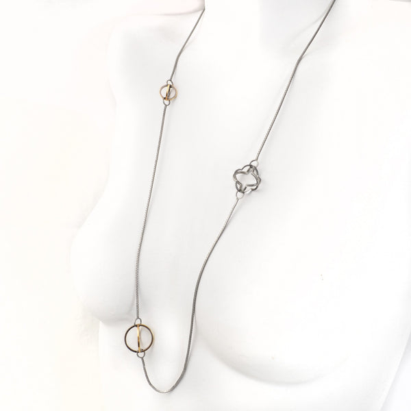 Three Dimensional Quatrefoil and Spheres are lit with 22k gold and contrasting Blackened Sterling Silver Long Necklace