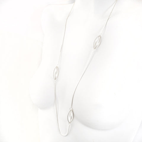 Streamline Lattis Shapes form a Minimal Siloutte on this Long Necklace in Sterling Silver